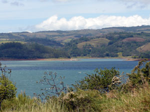 From the highway a few hundred yards west of the house, the surface of the windsurfing end of the lake s right beside the road.